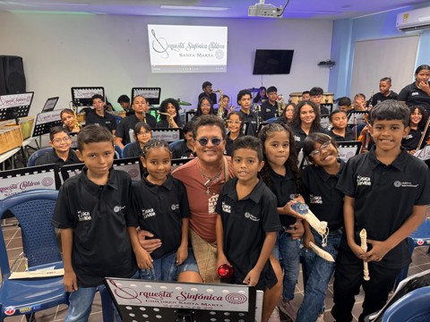 Carlos Vives with members of the Colombia Wind Orchestra