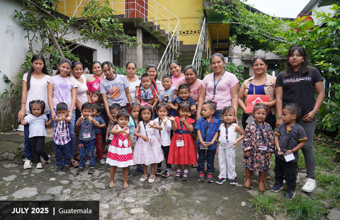 mothers and their children pose for the camera