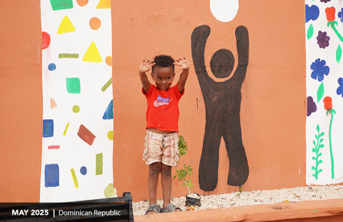 a child standing at the community center