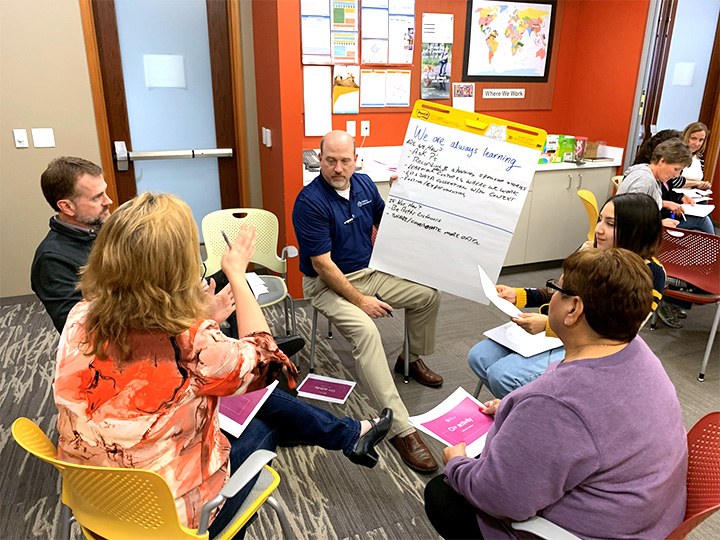 man participating in a workplace group activity