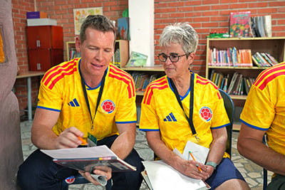 man and woman sitting and having discussion
