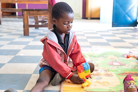 young child playing with blocks