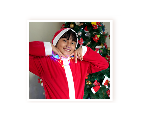 Sponsored boy in a Santa suit