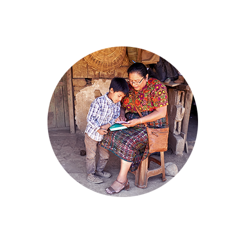 a woman sitting on a chair reading a book