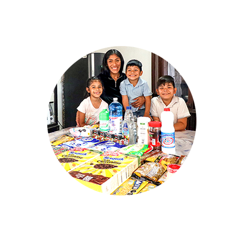 a woman and her family with donated food