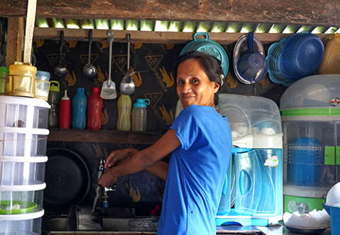 a woman at her house