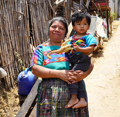 A woman with a child in her arms