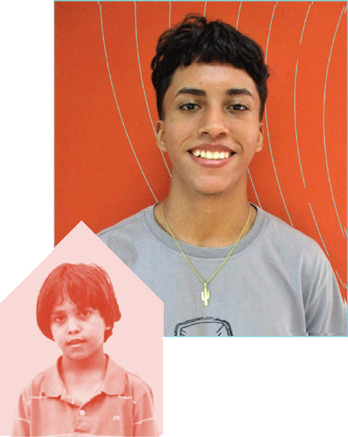 a young boy smiling to the camera