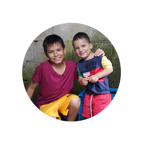 Sponsored brothers smile at the camera