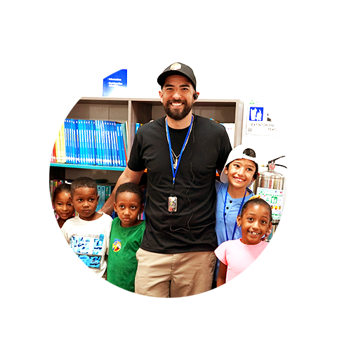 a man surrounded by children